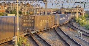 Containers on rail passing through Crewe, UK